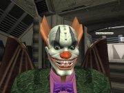 Avatar picture of John Foma Kalun, aka Pesok. He is shown wearing a green Tuxedo, a make up mask, and Bat wings